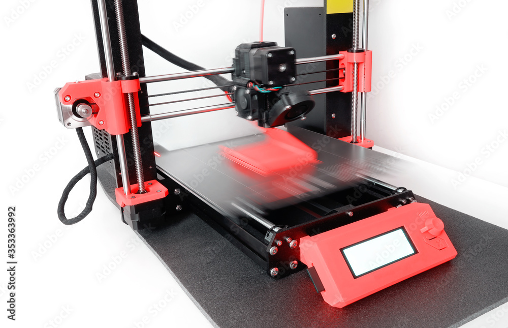 Modern 3D printer printing a plastic object with colored filament. New generation of 3D Printing Machine FFF (Fused Filament Fabrication) or FDM (Fused Deposition Modelling) Modern 3D printer printing a plastic object with colored filament. New generation of 3D Printing Machine FFF (Fused Filament Fabrication) or FDM (Fused Deposition Modelling)