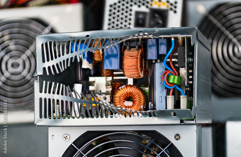 Ewaste disposal. Electronic components inside of damaged power supply