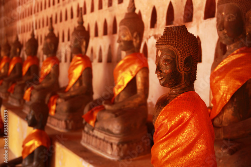 Many Buddha Statue around the Wall of Wat Si Saket.
Vientiane, Laos photo