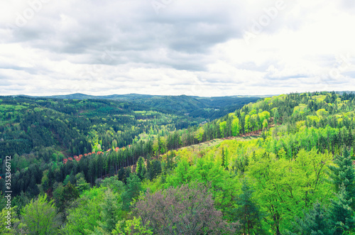 Slavkov Forest aerial panoramic view with hills and green trees near Carlsbad town  Karlovy Vary district  West Bohemia  Czech Republic