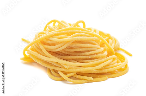 Fresh uncooked spaghetti pasta isolated on a white background
