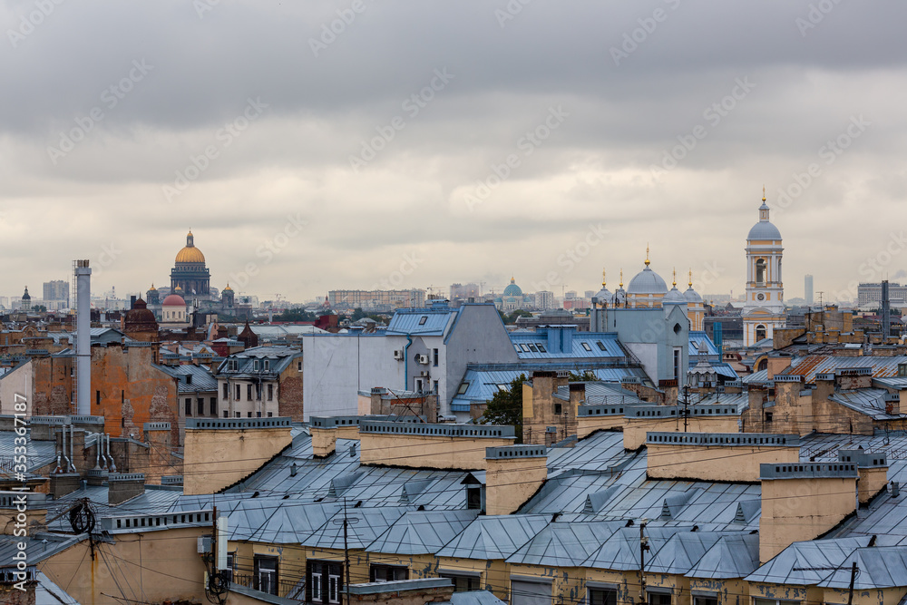 Beautiful top view of the historic city center of St. Petersburg. Cityscape with roofs of buildings, the bell tower of Vladimir Cathedral and the dome of St. Isaac's Cathedral. St. Petersburg, Russia.