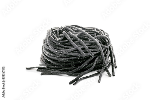 Fényképezés Black fresh spaghetti pasta with squid ink on a white isolated background