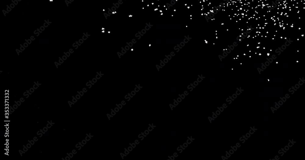 Strong snow blast at night. It shows shiny snowflakes falling from the sky fast against an isolated black background Strong snow blast at night. It shows shiny snowflakes falling from the sky fast against an isolated black background