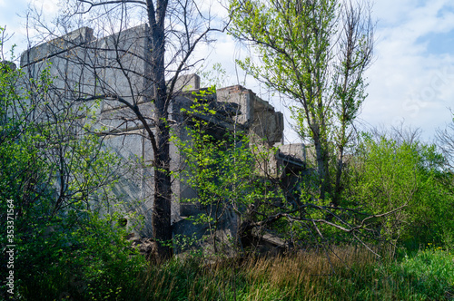 The ruined building. Old reinforced concrete structures. Ruin. The consequences of the war. © Aleksey