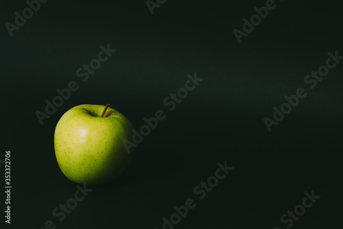 Single apple on black background