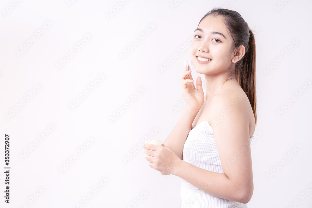 Young women experimenting with skin care creams. Two young woman applyng moisturizing cream. Beauty female with make up concept on the white background. Young women experimenting with skin care creams. Two young woman applyng moisturizing cream. Beauty female with make up concept on the white background.