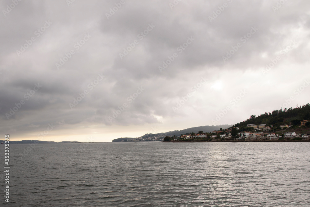 Views of evil land and sky, from a boat, of the Ria de Pontevedra in Galicia, Spain, Europe.