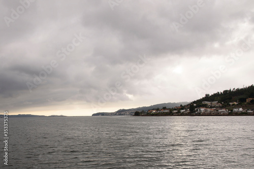 Views of evil land and sky, from a boat, of the Ria de Pontevedra in Galicia, Spain, Europe. © fuen30