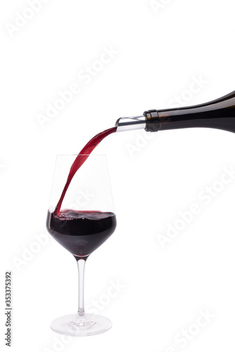 Pouring red wine with drop stop into crystal glass