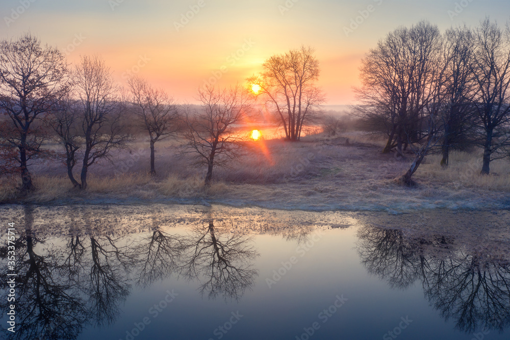 Autumn sunrise over lake