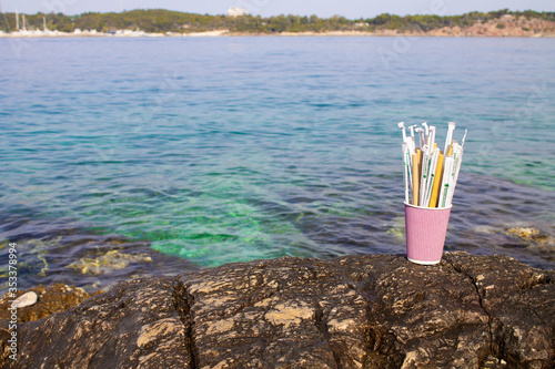 Greece-Athens-20.05.2020. Several replacements of plastic cocktail tubes, bioplastics and bamboo in the paper cup.