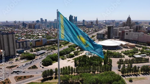 The flag of Kazakhstan is developing in the wind.Astana - Nur Sultan.Drone shooting.