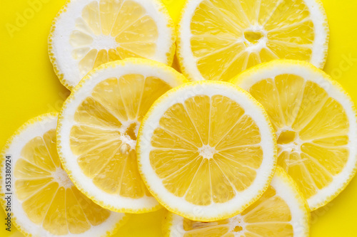 Background from bright juicy sliced lemon slices.