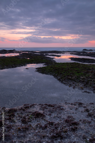 Photo of still waters at sunset near Tanah lot temple in Bali
