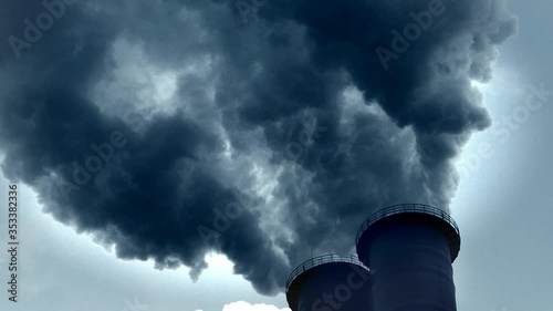 Dramatic smoke from a chimney. Air pollution from a coal-fired power station, close up and medium close shot photo