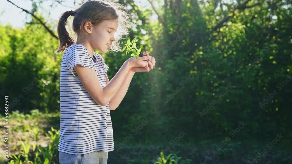 teen girl holding in hands green young plant. little farmer. gardening, planting teen girl holding in hands green young plant. little farmer. gardening, planting