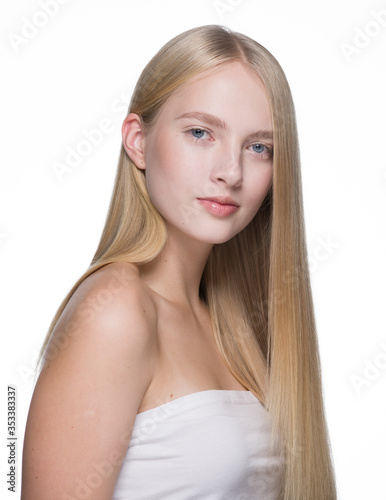 Woman Smooth long blond hair natural make up healthy skin isolated on white