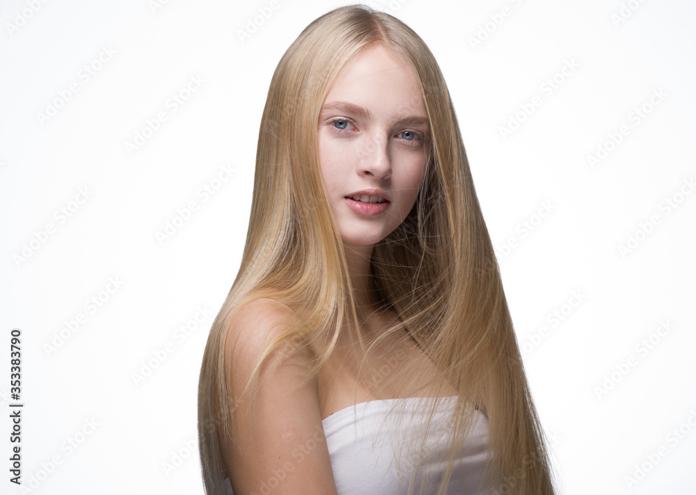 Woman Smooth long blond hair natural make up healthy skin isolated on white Woman Smooth long blond hair natural make up healthy skin isolated on white