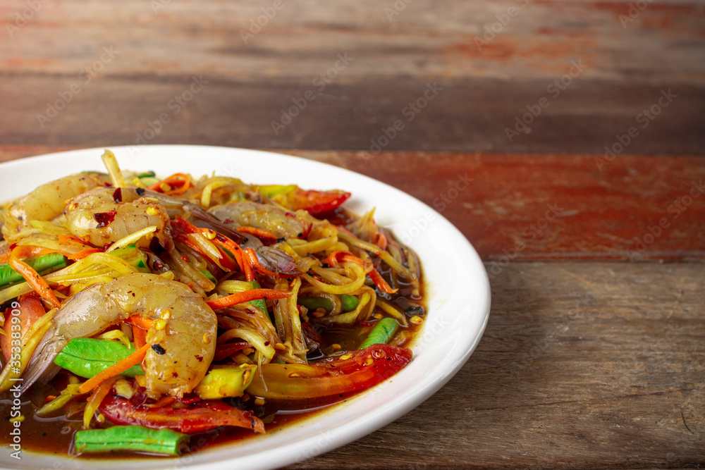 Thai Green Mango Salad with fresh shrimp. spicy food (Som Tum Mamuang). Thai Green Mango Salad with fresh shrimp. spicy food (Som Tum Mamuang).
