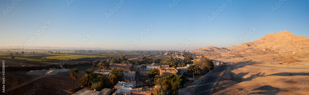 Aerial view over rural farmland and desert