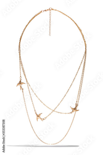 Detailed shot of a golden multi-row necklace with metal inserts in the form of flying birds and a lobster clasp Fototapeta