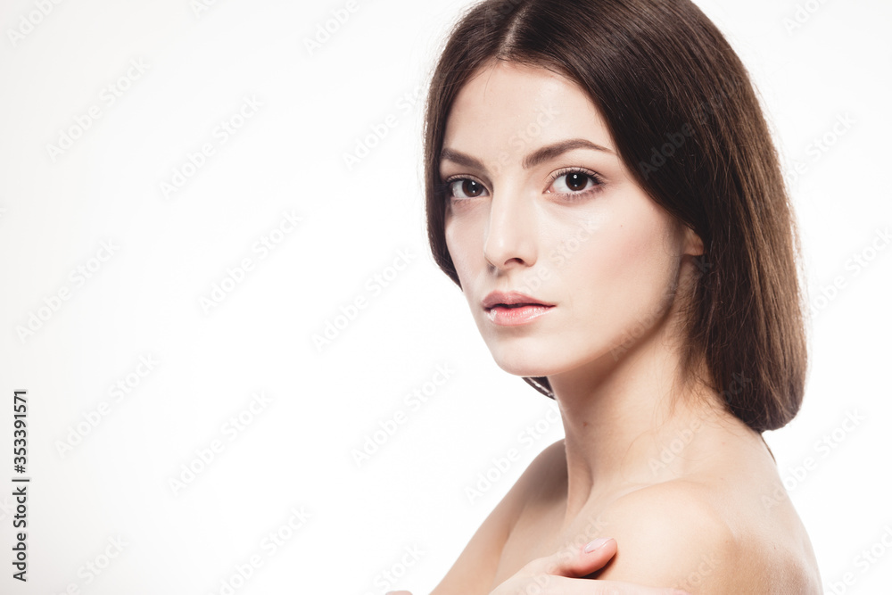 Obraz premium Young beautiful woman with hands portrait with healthy skin studio on white