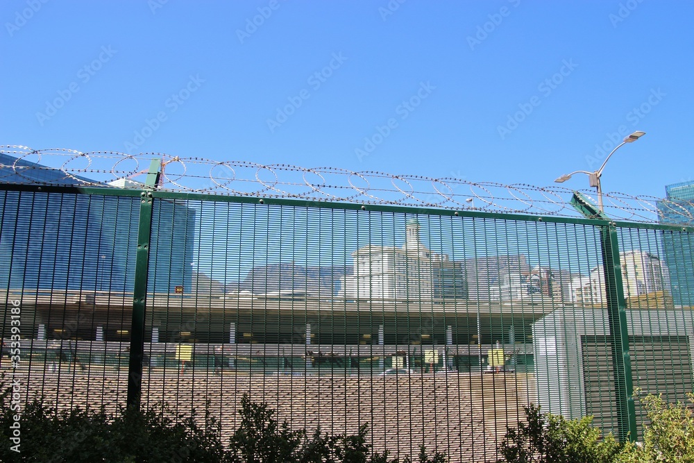 Downtown Cape town, Waterfront district, behind a high barbed fence. The Table mountain in the background. South Africa, Africa.