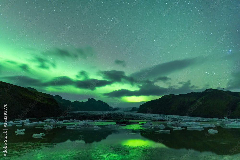 Aurora Borealis shining over beautiful lake in Iceland