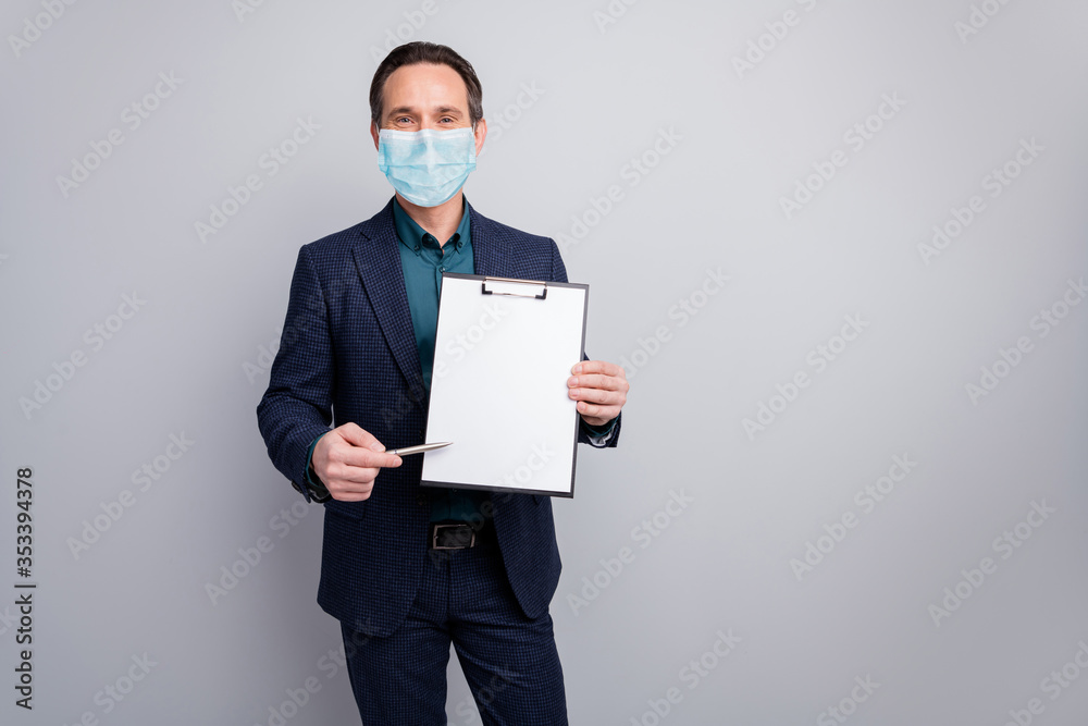 Portrait of his he nice attractive business manager man showing contract clipboard for signing medical life insurance quarantine stay home preventive measures isolated grey color background Portrait of his he nice attractive business manager man showing contract clipboard for signing medical life insurance quarantine stay home preventive measures isolated grey color background