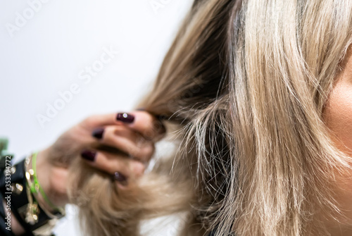 Professional hairdresser preparing client hair to haircut