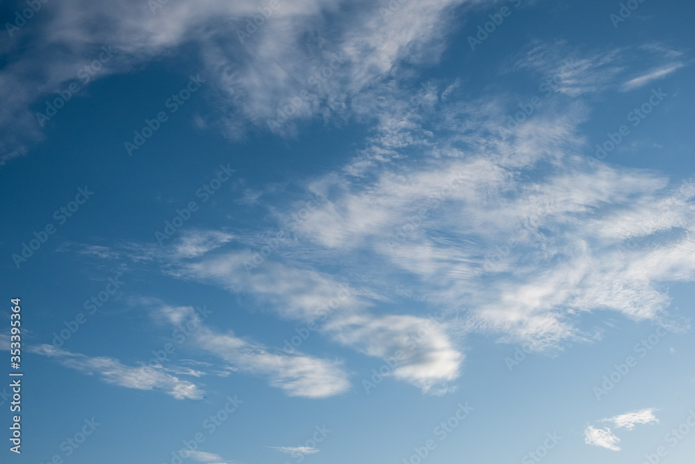 Spindrift beautiful white clouds. blue sky background