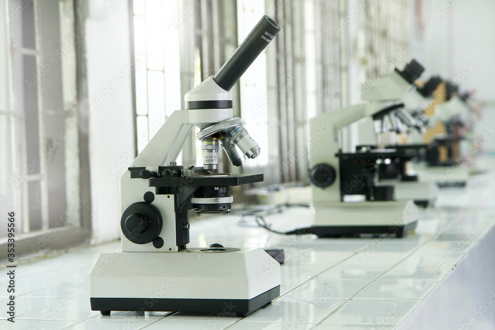 Microscope in laboratory. Medical equipment technology and research concept