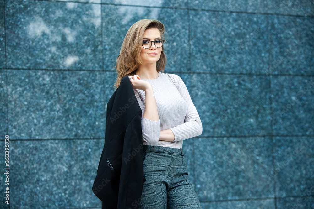 Confident business expert. Happy successful professional posing near office building. European girl. Russian business lady. Female business leader concept. Portrait Of Successful Business Woman Confident business expert. Happy successful professional posing near office building. European girl. Russian business lady. Female business leader concept. Portrait Of Successful Business Woman