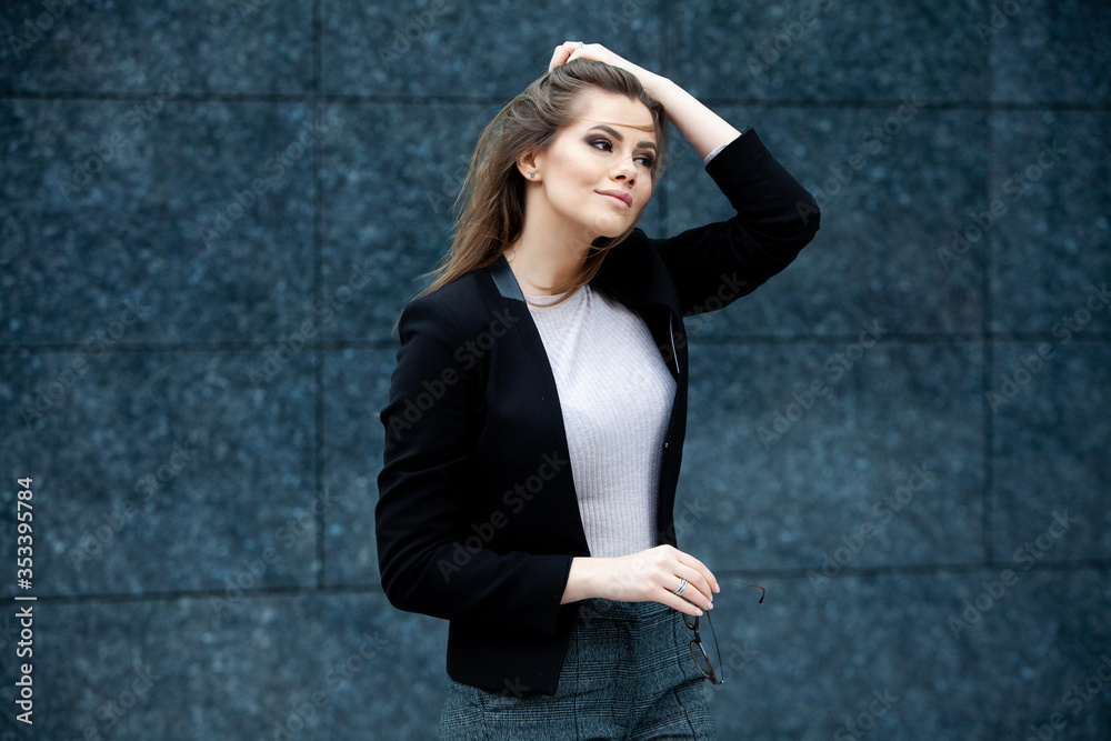 Confident business expert. Happy successful professional posing near office building. European girl. Russian business lady. Female business leader concept. Portrait Of Successful Business Woman Confident business expert. Happy successful professional posing near office building. European girl. Russian business lady. Female business leader concept. Portrait Of Successful Business Woman