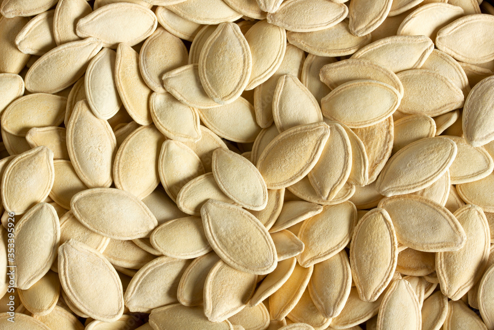 Fresh pumpkin seeds background. Close-up. Fresh pumpkin seeds background. Close-up.