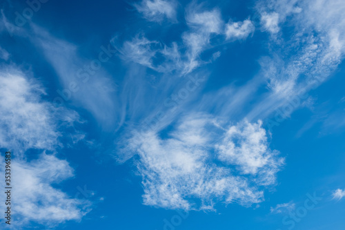 Beautiful white clouds at blue sky background photo