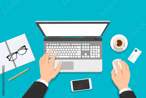 Vector flat illustration of man's hands working on computer with coffee, notebook, glasses and phone on the table - top view workplace
