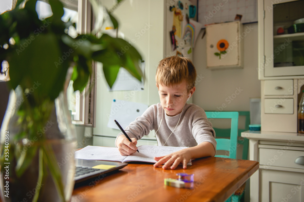 Young boy learning at home during quarantine Young boy learning at home during quarantine