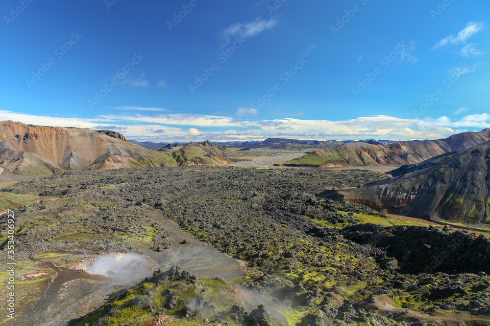 Landscape in Iceland. Green moss over the  volcanic mountains and lava fields in Landmannalaugar national park. Beautiful colored mountains and lava fields.Surreal nature scenery in highland.