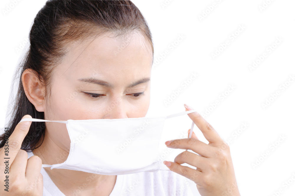 Closeup woman wearing face mask for protect air polution or virus covid 19 , health care and medical concept Closeup woman wearing face mask for protect air polution or virus covid 19 , health care and medical concept