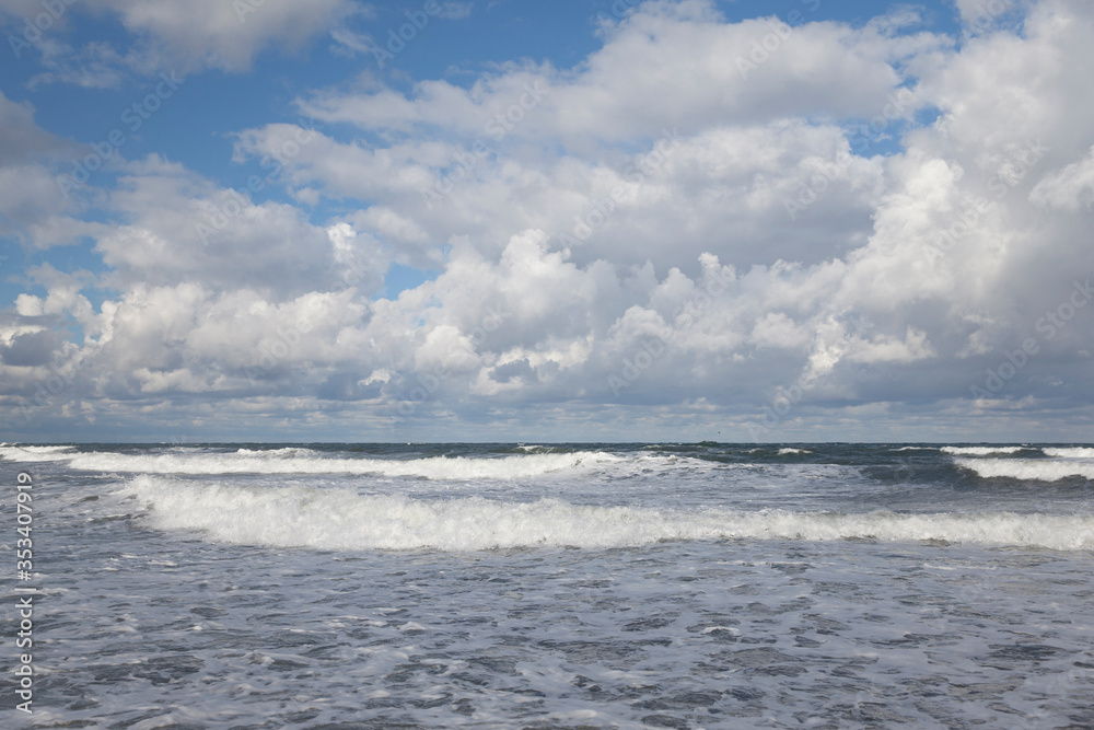 Seashore and clouds over the sea