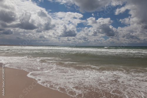 Seashore and clouds over the sea