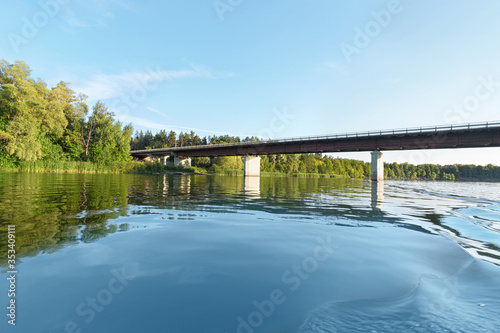 Old automobile bridge over the Cheremshan river in Ulyanovsk region in Russia. Blue sky and water