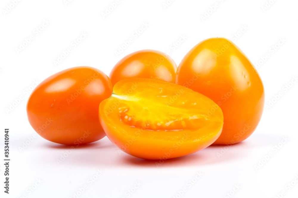 Yellow fresh tomatoes isolated on white background in close-up Yellow fresh tomatoes isolated on white background in close-up