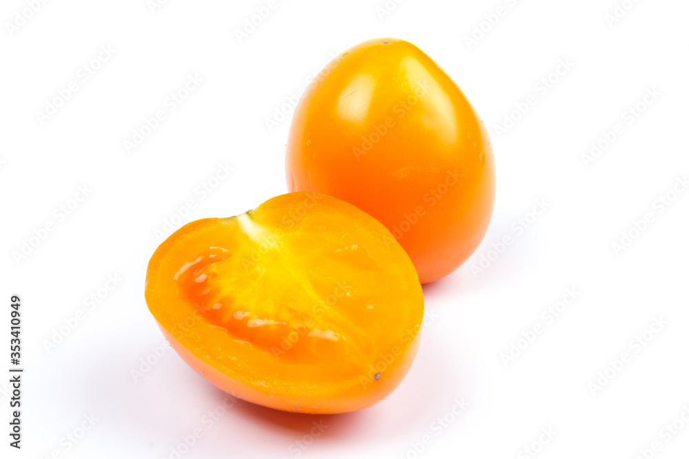 Yellow fresh tomatoes isolated on white background in close-up Yellow fresh tomatoes isolated on white background in close-up