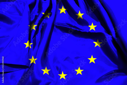 European Union flag on textile cloth background.