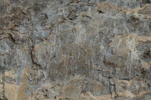 the texture of the cave or rocky cliffs are rugged with vignette background