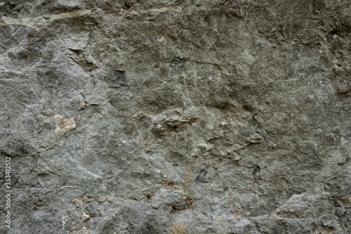 the texture of the cave or rocky cliffs are rugged with vignette background
