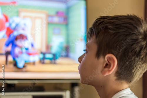 Boy watching his favorite show on TV